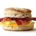 delicious breakfast biscuit sandwich with egg cheese and bacon on a white background studio shot capturing the essence of a tasty morning meal food photography