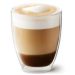 a clear glass cup filled with a layered coffee drink, topped with a dollop of foam, against a white background.