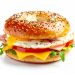 breakfast bagel sandwich with ham, egg, and cheese, white background. ai